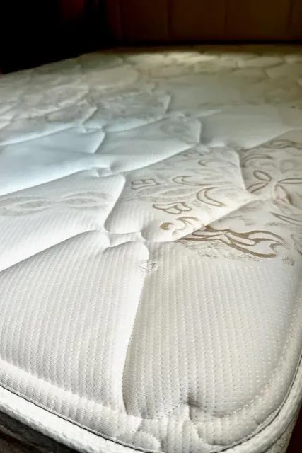 Slide: The Image of Close-up of a mattress in a 2000 Silverton 392 Motor Yacht. - 15