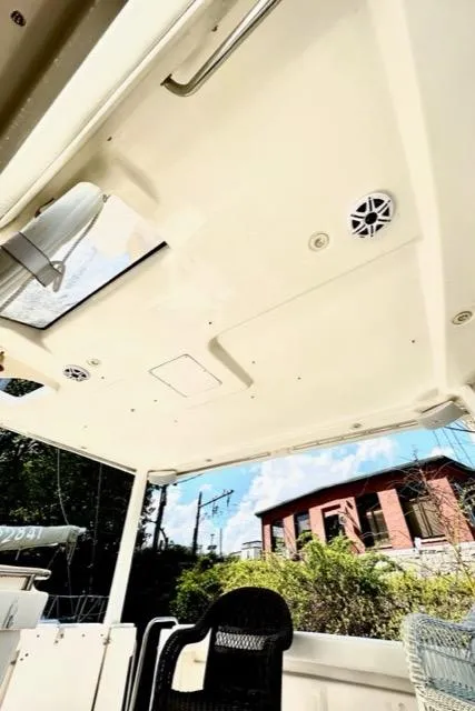 Slide: The Image of Interior view of 2000 Silverton 392 Motor Yacht with skylight and outdoor seating. - 18