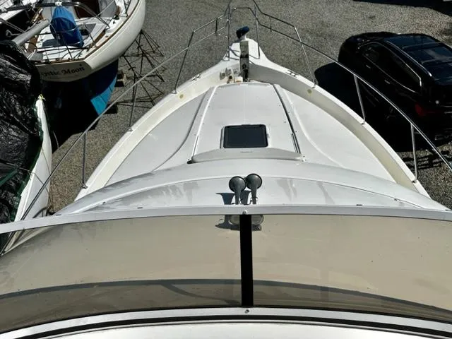 Slide: The Image of Top view of a 2000 Silverton 392 Motor Yacht in a boatyard. - 26