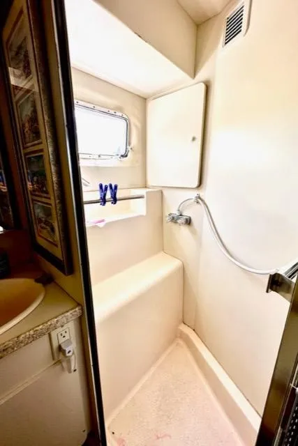 Slide: The Image of 2000 Silverton 392 Motor Yacht bathroom with shower and sink. - 28