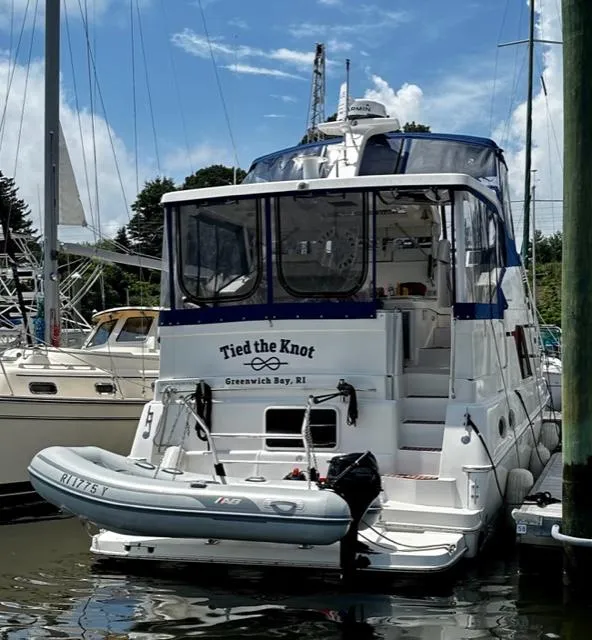 Slide: The Image of 2000 Silverton 392 Motor Yacht docked in Greenwich Bay, RI, named Tied the Knot. - 3