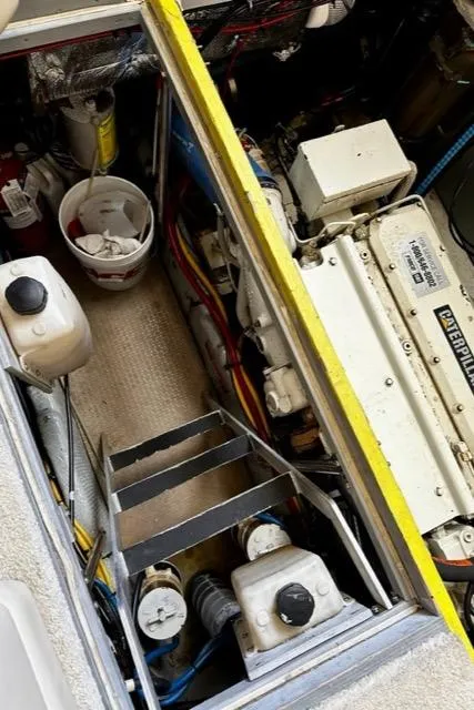 Slide: The Image of Engine room of a 2000 Silverton 392 Motor Yacht with visible machinery and equipment. - 37