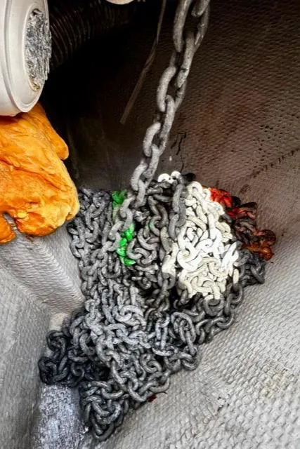 Slide: The Image of Anchor chain storage on a 2000 Silverton 392 Motor Yacht. - 42
