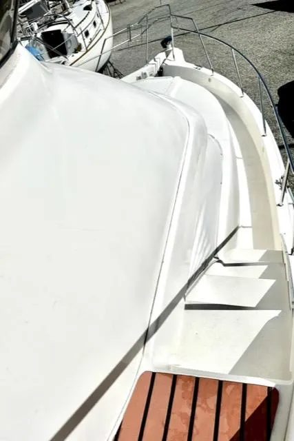 Slide: The Image of Top view of a 2000 Silverton 392 Motor Yacht's deck and railing. - 43