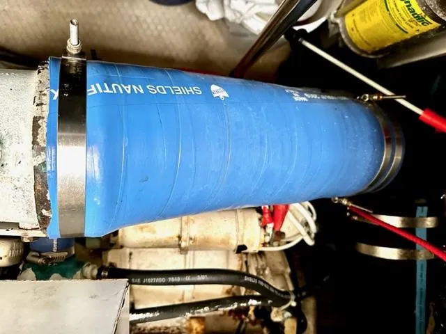 Slide: The Image of Close-up of engine compartment in 2000 Silverton 392 Motor Yacht with blue Shields Nautiflex hose. - 49