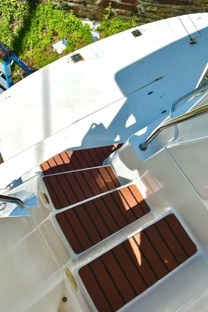 Slide: The Image of Steps on a 2000 Silverton 392 Motor Yacht with wooden accents. - 7