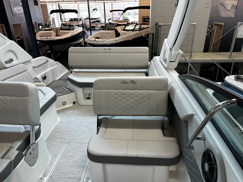 Slide: The Image of 2023 Sea Ray SDX 250 boat interior with luxurious seating and modern design. - 10