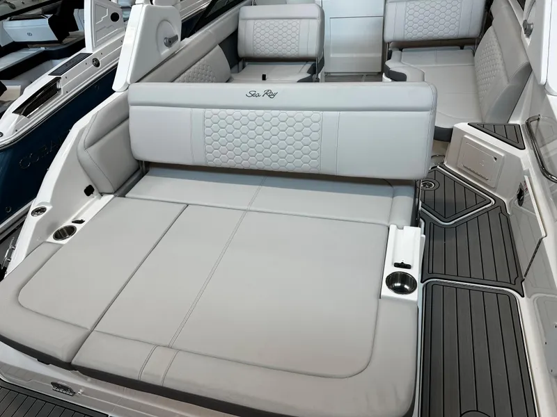 Slide: The Image of 2023 Sea Ray SDX 250 boat interior with luxurious seating and modern design. - 11