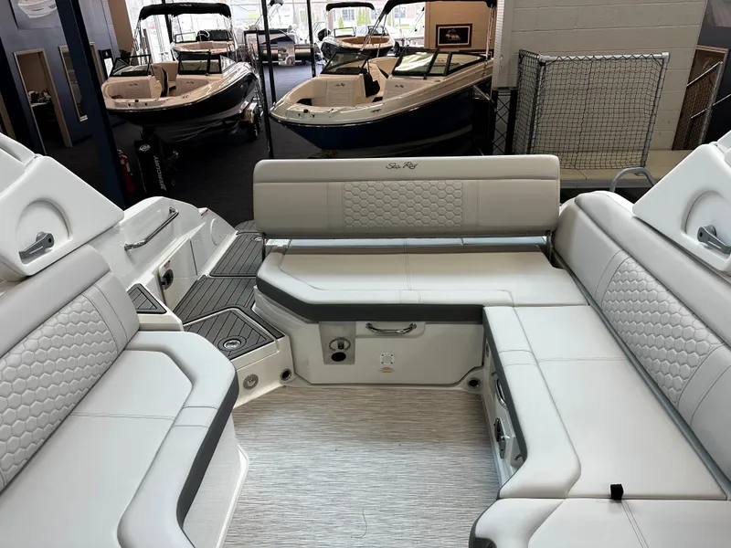 Slide: The Image of 2023 Sea Ray SDX 250 boat interior with luxurious white seating and modern design. - 12