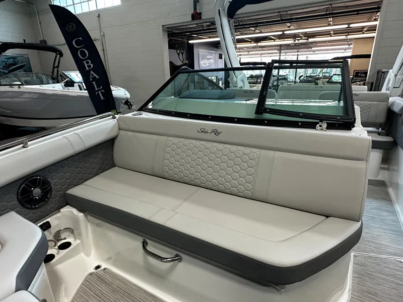 Slide: The Image of 2023 Sea Ray SDX 250 boat interior with cushioned seating and modern design. - 21