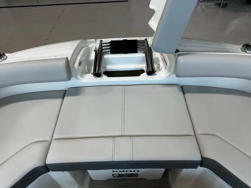 Slide: The Image of 2023 Sea Ray SDX 250 boat interior with cushioned seating and storage compartment. - 22