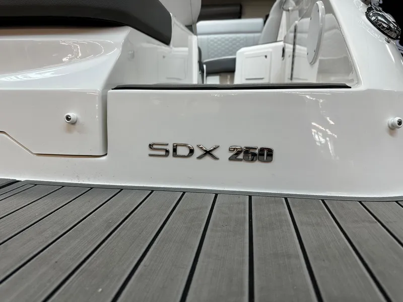 Slide: The Image of 2023 Sea Ray SDX 250 boat interior with logo on deck. - 6