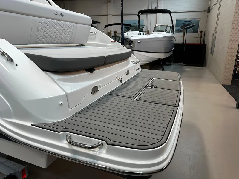 Slide: The Image of 2023 Sea Ray SDX 250 boat with spacious swim platform in showroom. - 8