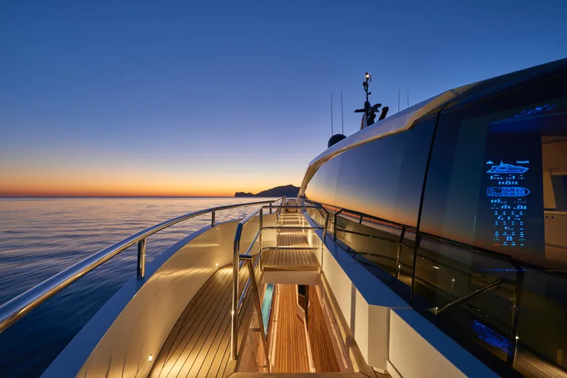 Slide: The Image of Astondoa 110 Century 2023 yacht at sunset, sleek design and luxurious deck. - 11