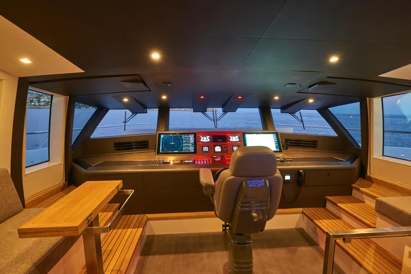 Slide: The Image of Modern helm station of 2023 Astondoa 110 Century yacht with advanced navigation systems. - 12
