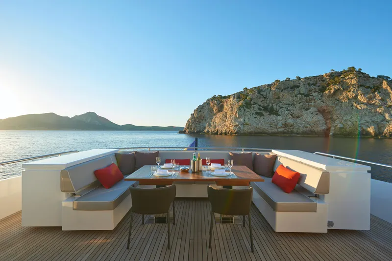 Slide: The Image of Luxury dining area on the 2023 Astondoa 110 Century yacht with scenic ocean view. - 18