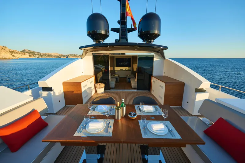 Slide: The Image of Luxury dining area on the 2023 Astondoa 110 Century yacht, set against a serene ocean backdrop. - 19