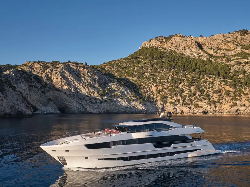 Slide: The Image of 2023 Astondoa 110 Century yacht cruising near rocky coastline. - 3