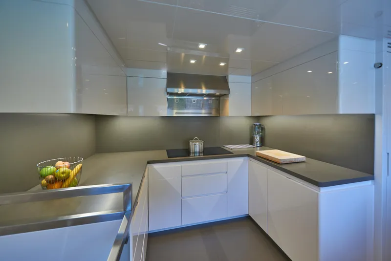Slide: The Image of Modern kitchen in 2023 Astondoa 110 Century yacht with sleek white cabinetry. - 30