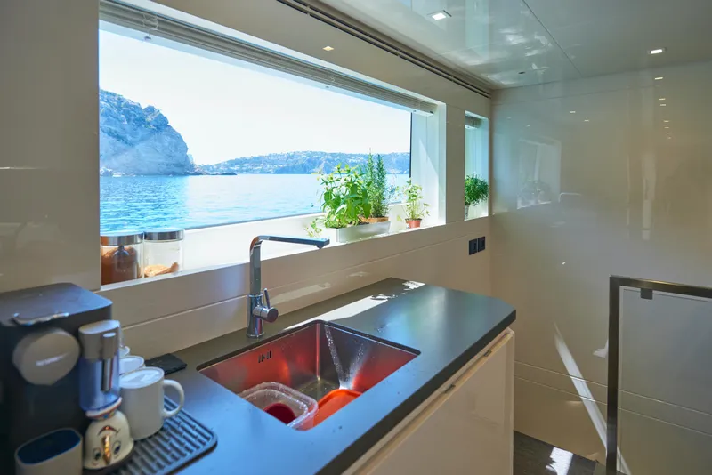 Slide: The Image of Modern kitchen on 2023 Astondoa 110 Century yacht with ocean view. - 31