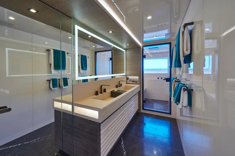 Slide: The Image of Modern bathroom on the 2023 Astondoa 110 Century yacht with double sinks and sleek design. - 35