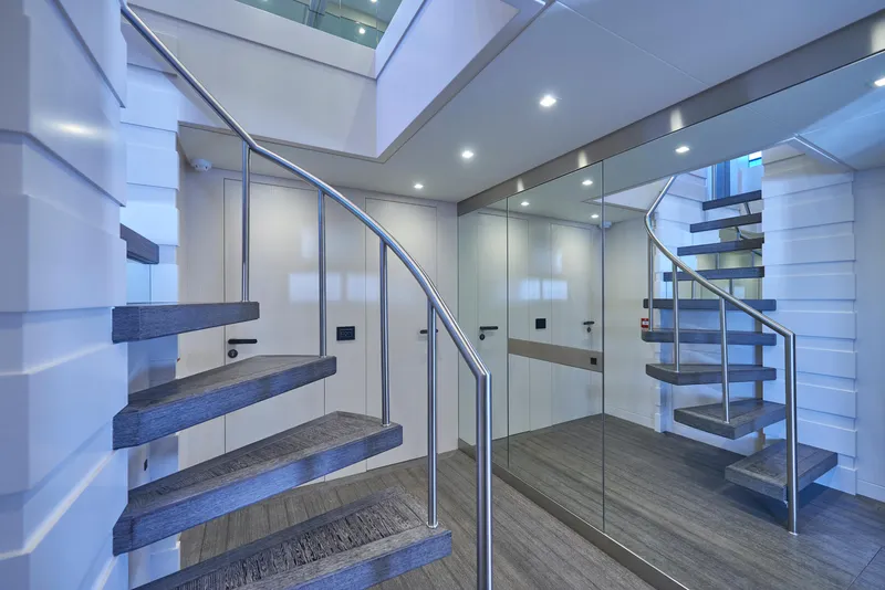 Slide: The Image of Modern interior staircase of 2023 Astondoa 110 Century yacht with sleek design and mirrored walls. - 36
