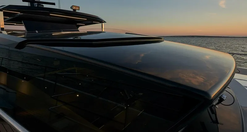 Slide: The Image of Astondoa 100 Century 2023 yacht at sunset on the water. - 10