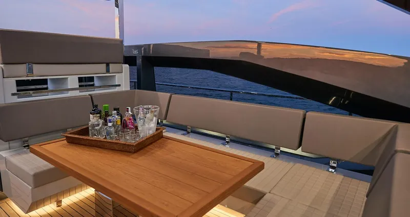 Slide: The Image of Luxury seating area on the 2023 Astondoa 100 Century yacht at sunset. - 17