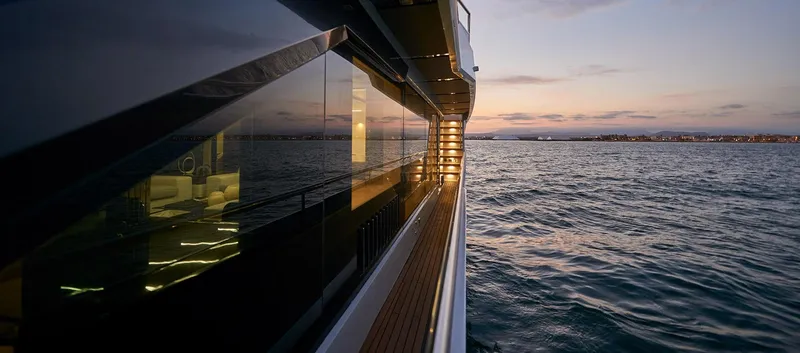 Slide: The Image of Side view of 2023 Astondoa 100 Century yacht at sunset on the water. - 20