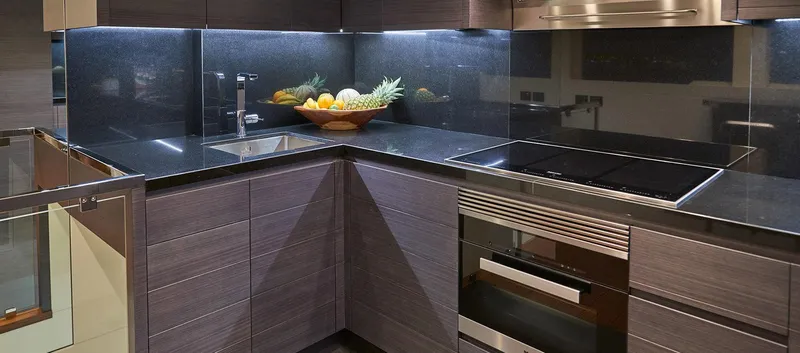 Slide: The Image of Modern kitchen in 2023 Astondoa 100 Century yacht with sleek black countertops. - 31