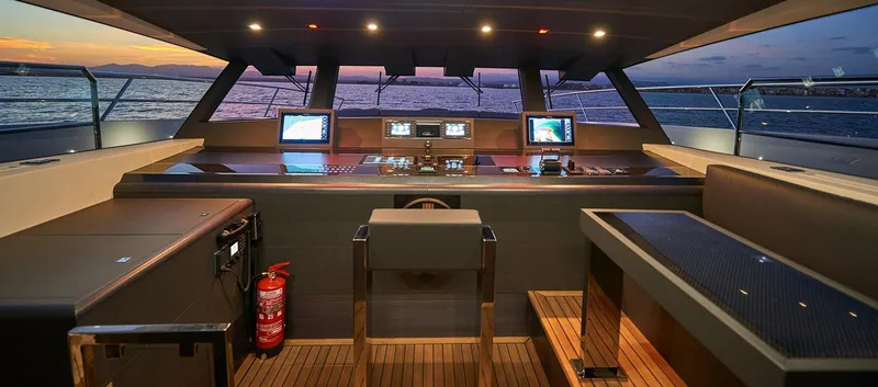 Slide: The Image of Astondoa 100 Century 2023 yacht cockpit with modern navigation systems at sunset. - 35