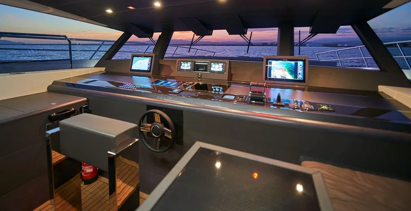 Slide: The Image of 2023 Astondoa 100 Century yacht helm with advanced navigation systems at sunset. - 36