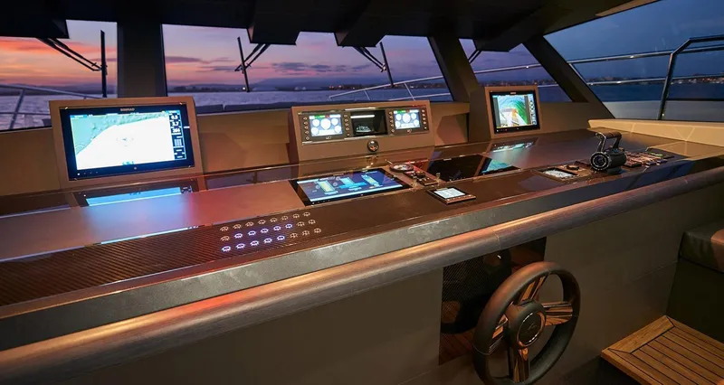 Slide: The Image of Astondoa 100 Century 2023 yacht helm with advanced navigation systems at sunset. - 37