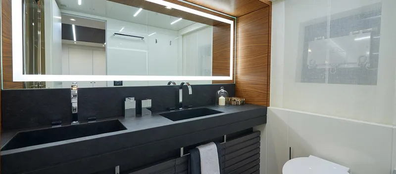 Slide: The Image of Modern bathroom in 2023 Astondoa 100 Century yacht with dual sinks and illuminated mirror. - 49