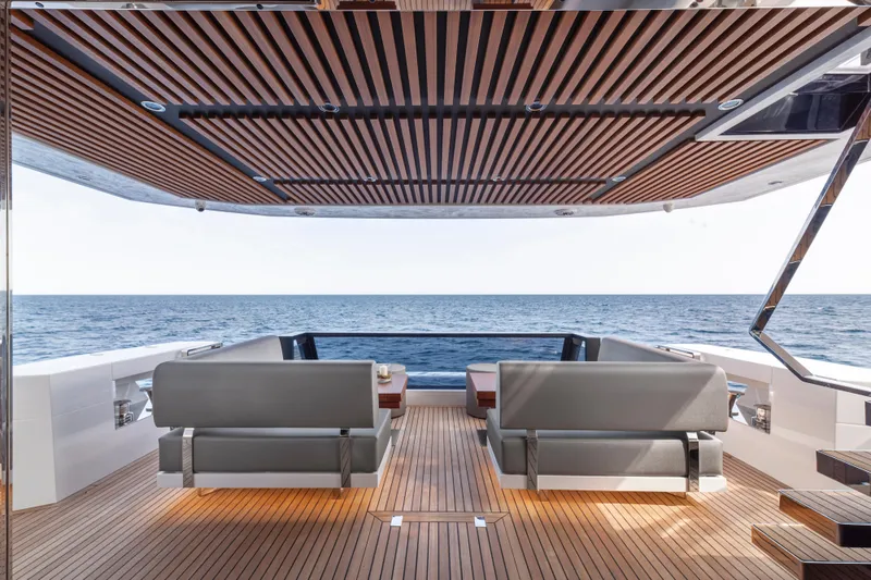 Slide: The Image of 2023 Astondoa AS8 Flybridge yacht with luxurious deck seating and ocean view. - 15