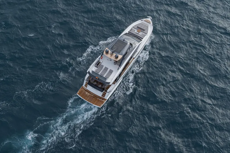 Slide: The Image of Aerial view of 2023 Astondoa AS8 Flybridge yacht cruising on the ocean. - 5