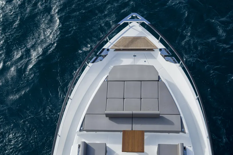 Slide: The Image of 2023 Astondoa AS8 Flybridge yacht bow with sun loungers and table. - 8