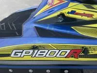 Slide: The Image of 2017 Yamaha Boats GP1800 jet ski, blue and yellow, close-up view. - 10