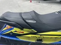 Slide: The Image of 2017 Yamaha GP1800 jet ski with black seat and vibrant yellow-blue graphics. - 11