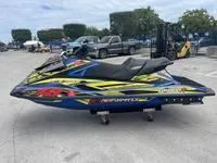 Slide: The Image of 2017 Yamaha GP1800 jet ski in a parking lot. - 6