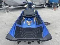 Slide: The Image of 2017 Yamaha Boats GP1800 blue jet ski parked on concrete. - 8
