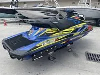 Slide: The Image of 2017 Yamaha GP1800 jet ski in blue and yellow, parked on a trailer. - 9