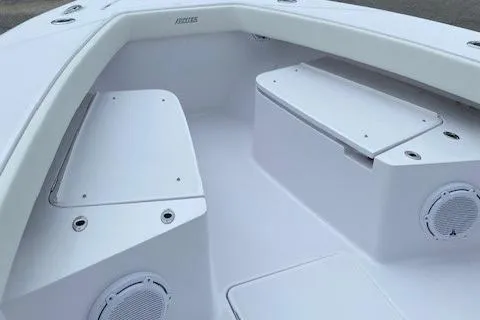 Slide: The Image of 2023 Jupiter 32 boat interior with white seating and storage compartments. - 12