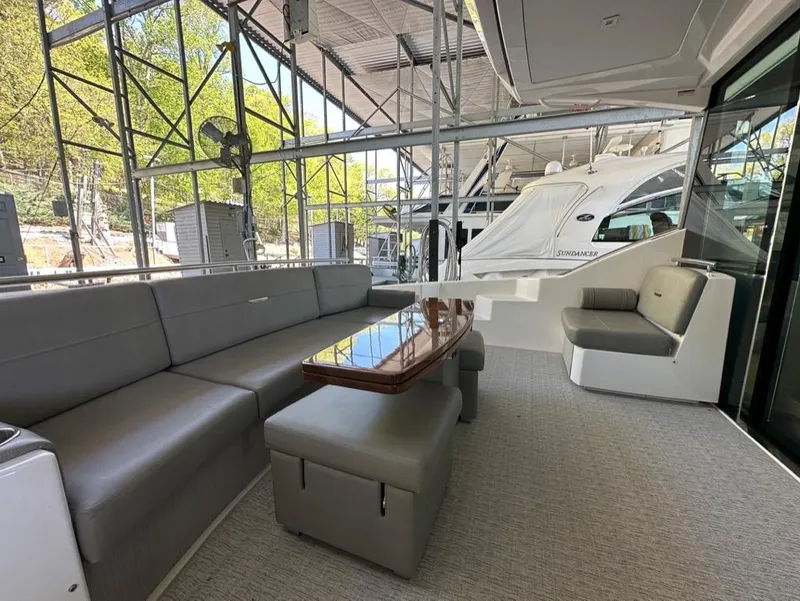 Slide: The Image of 2019 Tiara Yachts C53 interior with modern seating and table. - 11