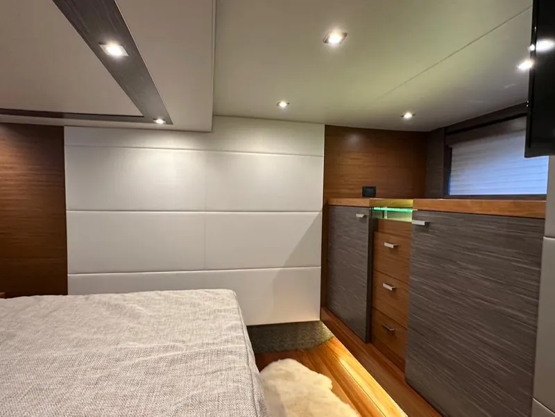 Slide: The Image of 2019 Tiara Yachts C53 interior cabin with modern design and ambient lighting. - 25