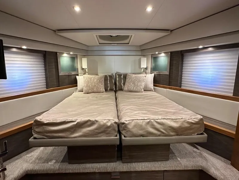 Slide: The Image of Luxurious bedroom interior of 2019 Tiara Yachts C53 with twin beds and modern lighting. - 22