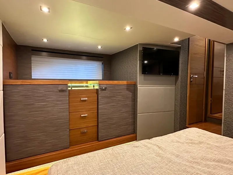 Slide: The Image of Interior cabin of 2019 Tiara Yachts C53 with modern furnishings and TV. - 26