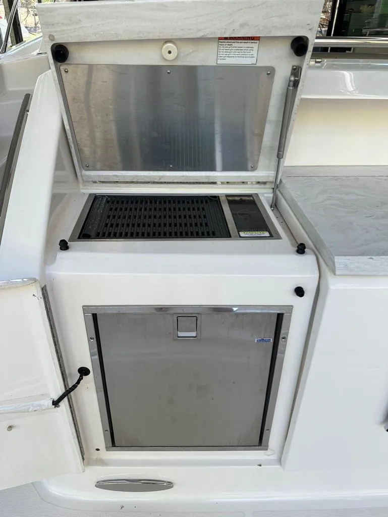 Slide: The Image of Outdoor grill and storage compartment on a 2019 Tiara Yachts C53. - 9