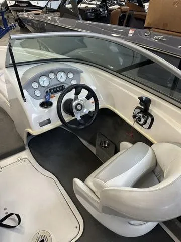 Slide: The Image of 2011 Reinell 207 LS boat interior with steering wheel and dashboard. - 4