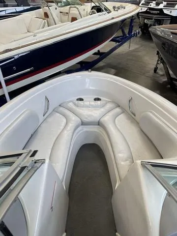 Slide: The Image of 2011 Reinell 207 LS boat interior with white seating and open bow. - 5